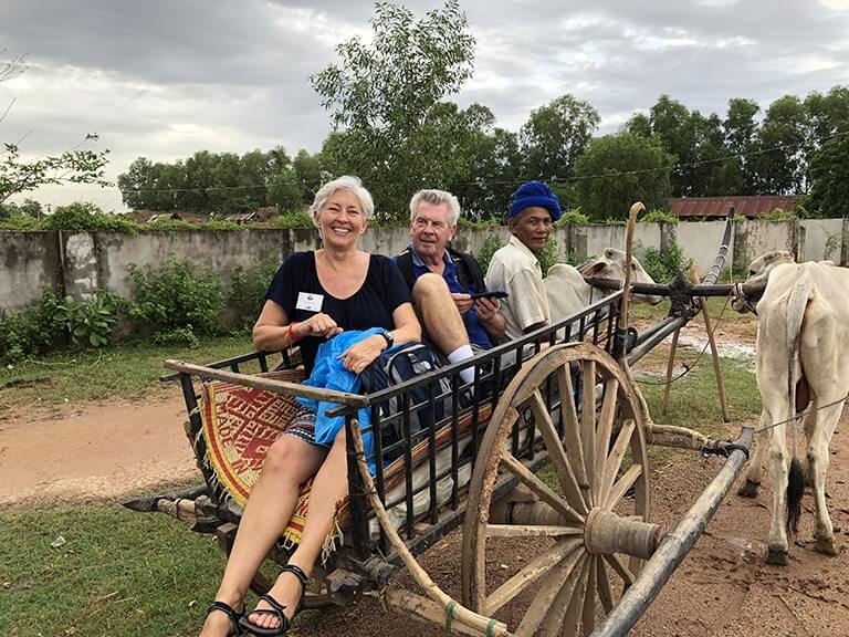 Sharing an ox cart ride with Ray Stapley